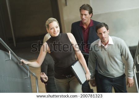 Business people walking on stairs elevated view