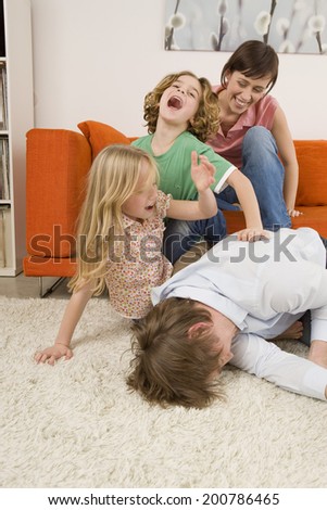 Playful family in living room