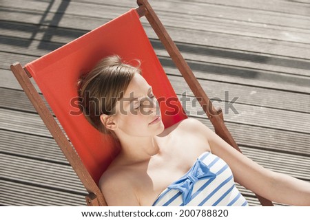 Hamburg, Germany, Woman resting on deck chair
