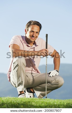 Italy, Kastelruth, Man on golf course smiling