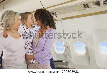Senior woman mother and girl on airplane