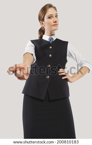 Close up of angry young air hostess pointing