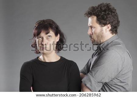 Mature couple man angry woman feeling guilty