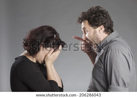 Mature couple quarreling man shouting woman crying