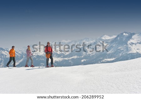 Austria, Salzburger Land, Altenmarkt, Zauchensee, Three persons cross country skiing in mountains