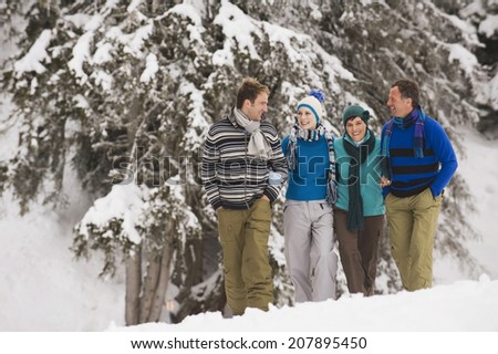 Italy, South Tyrol, Young people taking a winter walk