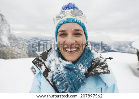 Italy, South Tyrol, Woman in winter clothes, smiling, portrait
