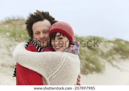 Germany St.Peter-Ording North Sea couple embracing on beach
