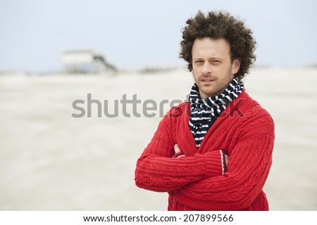 Germany St Peter-Ording North sea man standing with arms crossed