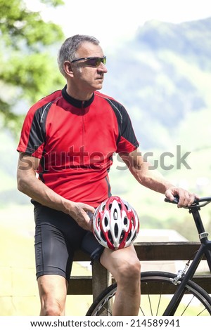 Mature man with racing bicycle, Freiburg, Germany