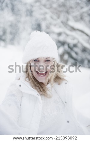 Austria, Altenmarkt, Woman with snowy face smiling, portrait
