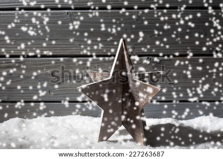 Star decoration red christmas spheres on pile of snow against wooden wall
