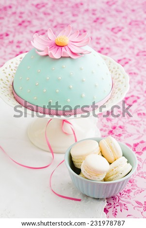 Round cake decorated with fondant and gum paste flowers