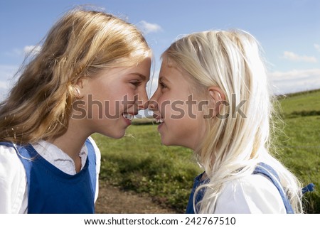 Two girls nose to nose, portrait