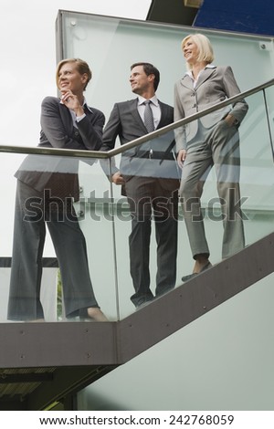 Germany,business people standing on stairs