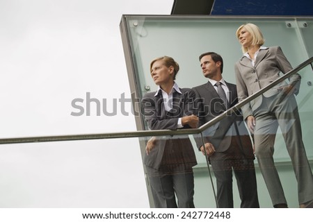 Germany,business people standing on stairs