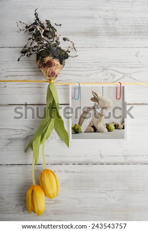 Tulip bulb and picture with easter bunny hanging on ribbon
