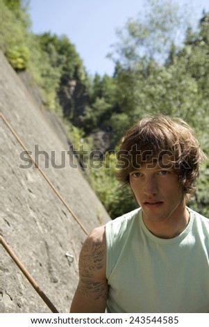 Young man in climbing wall, portrait