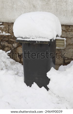 Germany, Garbage bin covered by snow