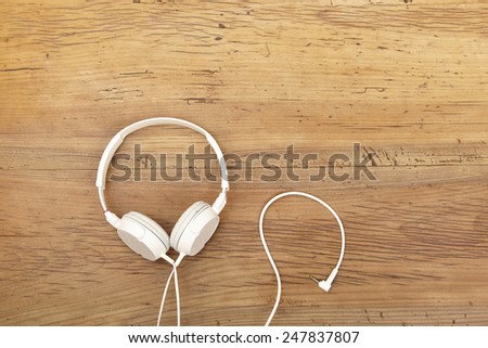 White headphones on wood