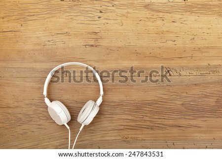 White headphones on wood