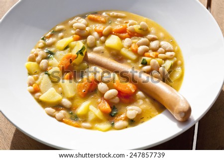 Bean soup with wiener on soup plate
