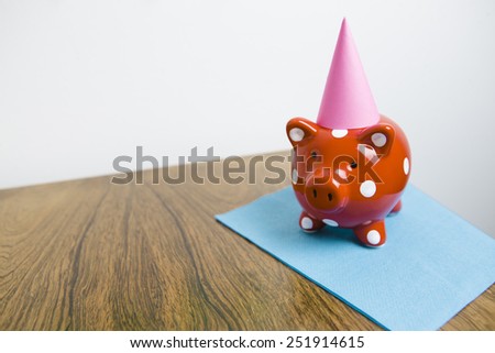 Red piggy bank having a party