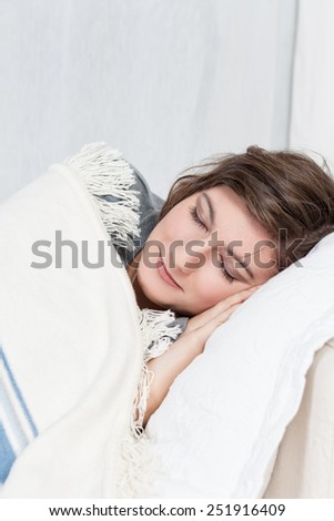 Young woman sleeping on couch