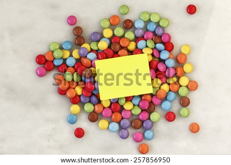 Smarties on marble, blank note