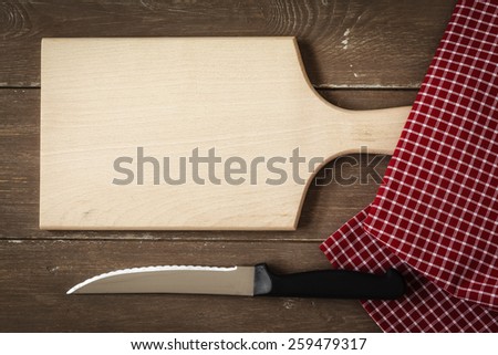 Chopping board, kitchen towel and knife