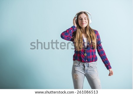 Young girl with head phones listening to music