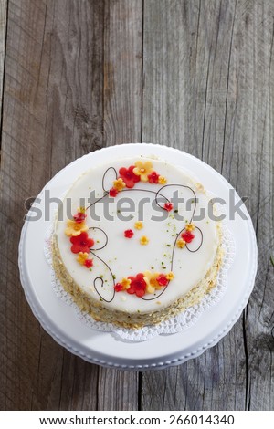 Decorated wine cream cake on cake stand