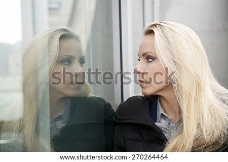 Young woman, mirrored