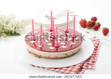 Strawberry-cream cake with birthday candles
