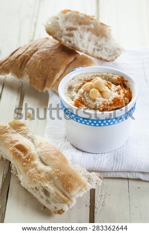 Hummus in bowl and flat bread