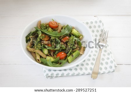 Whole-grain spelt rigatoni with green asparagus, cherry tomato and rocket-pesto