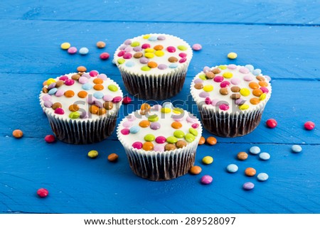 Chocolate cupcakes with colourful chocolate drops