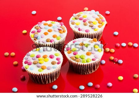 Chocolate cupcakes with colourful chocolate drops