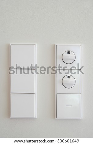 Germany,Upper Bavaria,Munich,Close up of electric switch and dimmer switch against white wall