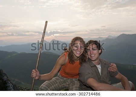 Austria,Salzburg Country,Couple sitting on mountains of Niedere Tauern