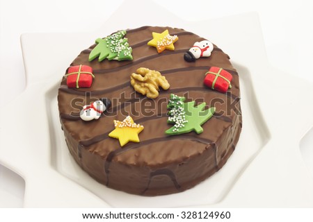 Walnut cake with chocolate coating and marzipan deco