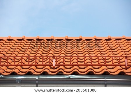 Red tile roof with stairs