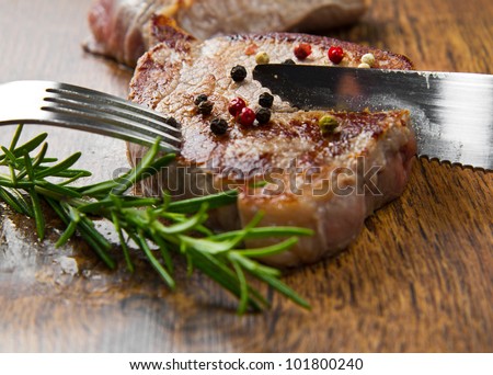 grilled meat fillet on wooden background