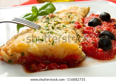 cooked cod loins with home made tomato sauce and oil