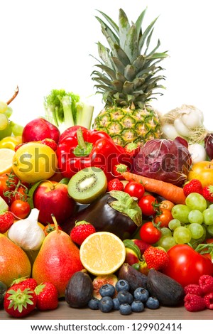 Fruits and vegetables like tomatoes, zucchini, melons, bananas and grapes arranged in a group, natural still life for healthy food