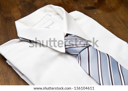 New white man\'s shirt and tie isolated on wood