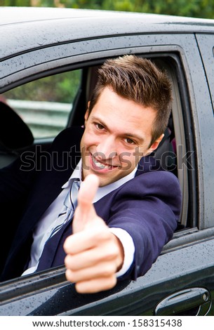 Happy man in his new car
