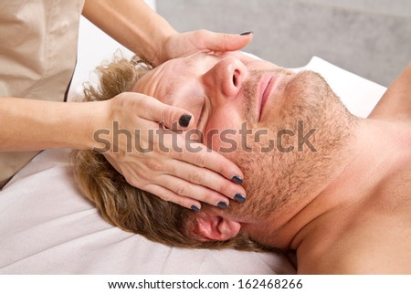 Man getting massage in the beauty center