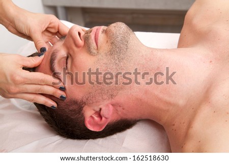Man getting massage in the beauty center