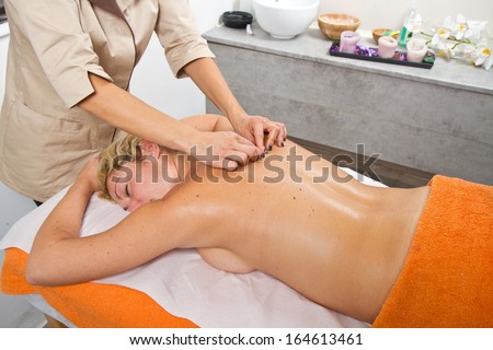 Relaxed woman having a massage in a beauty center